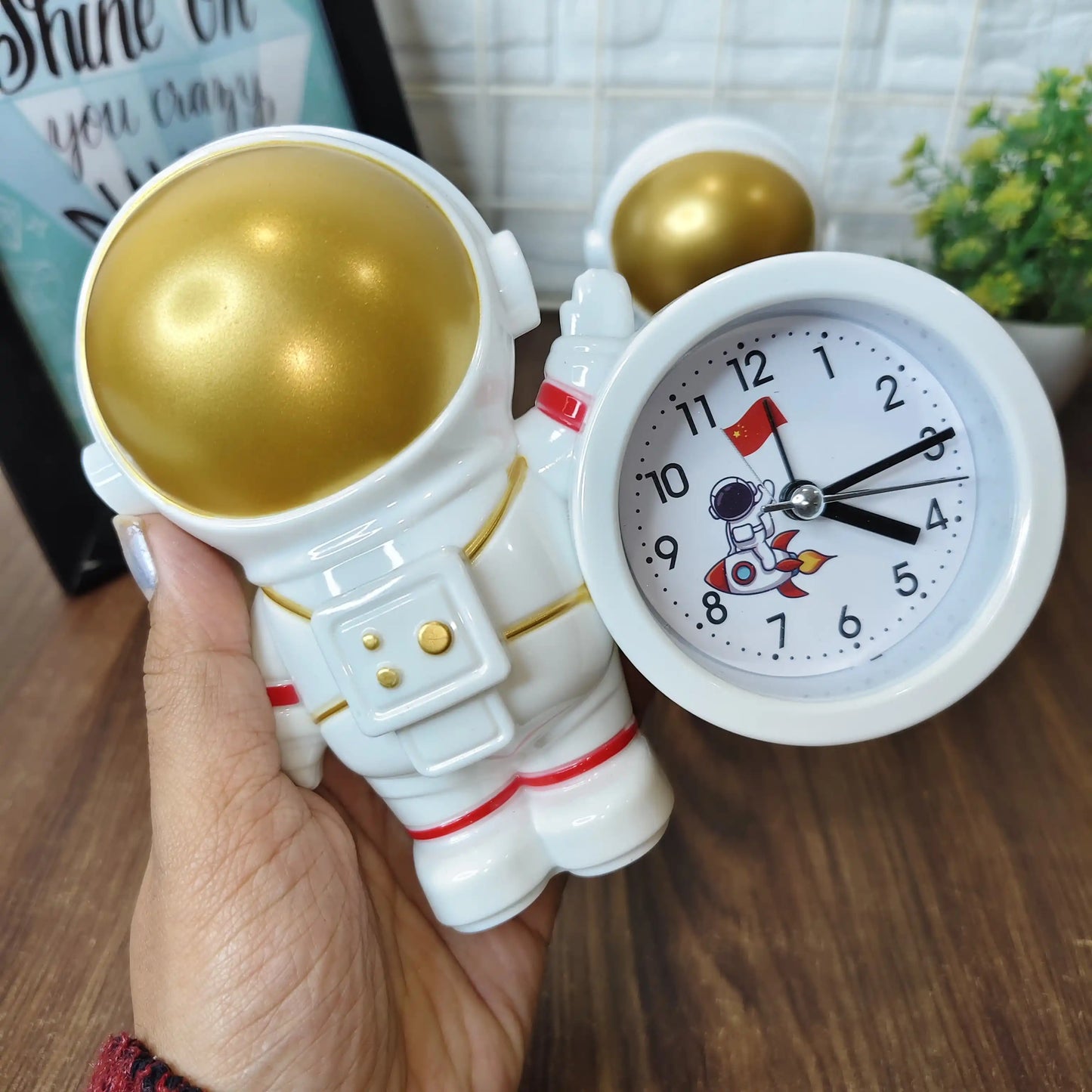 Alarm clock with pen stand