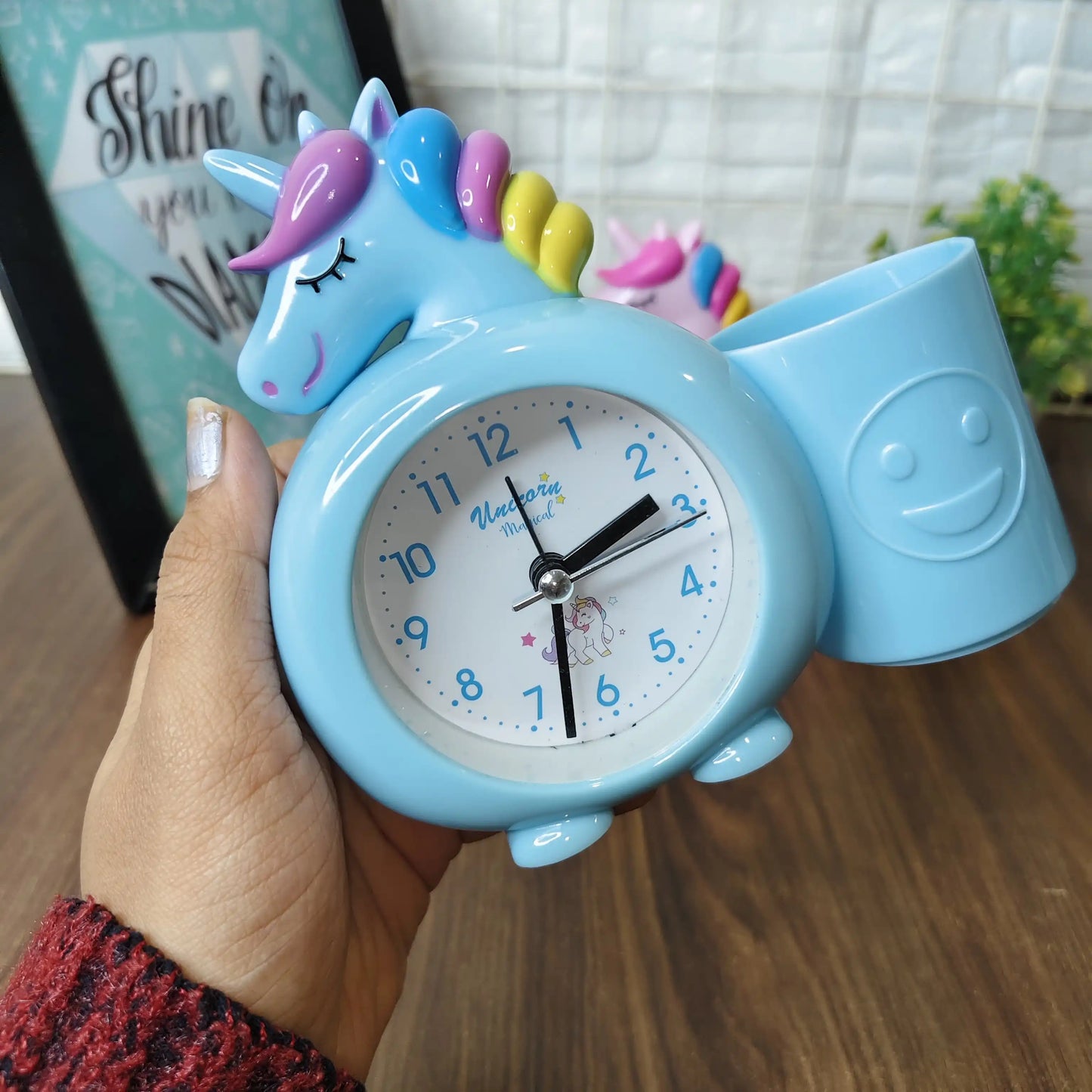 Alarm clock with pen stand