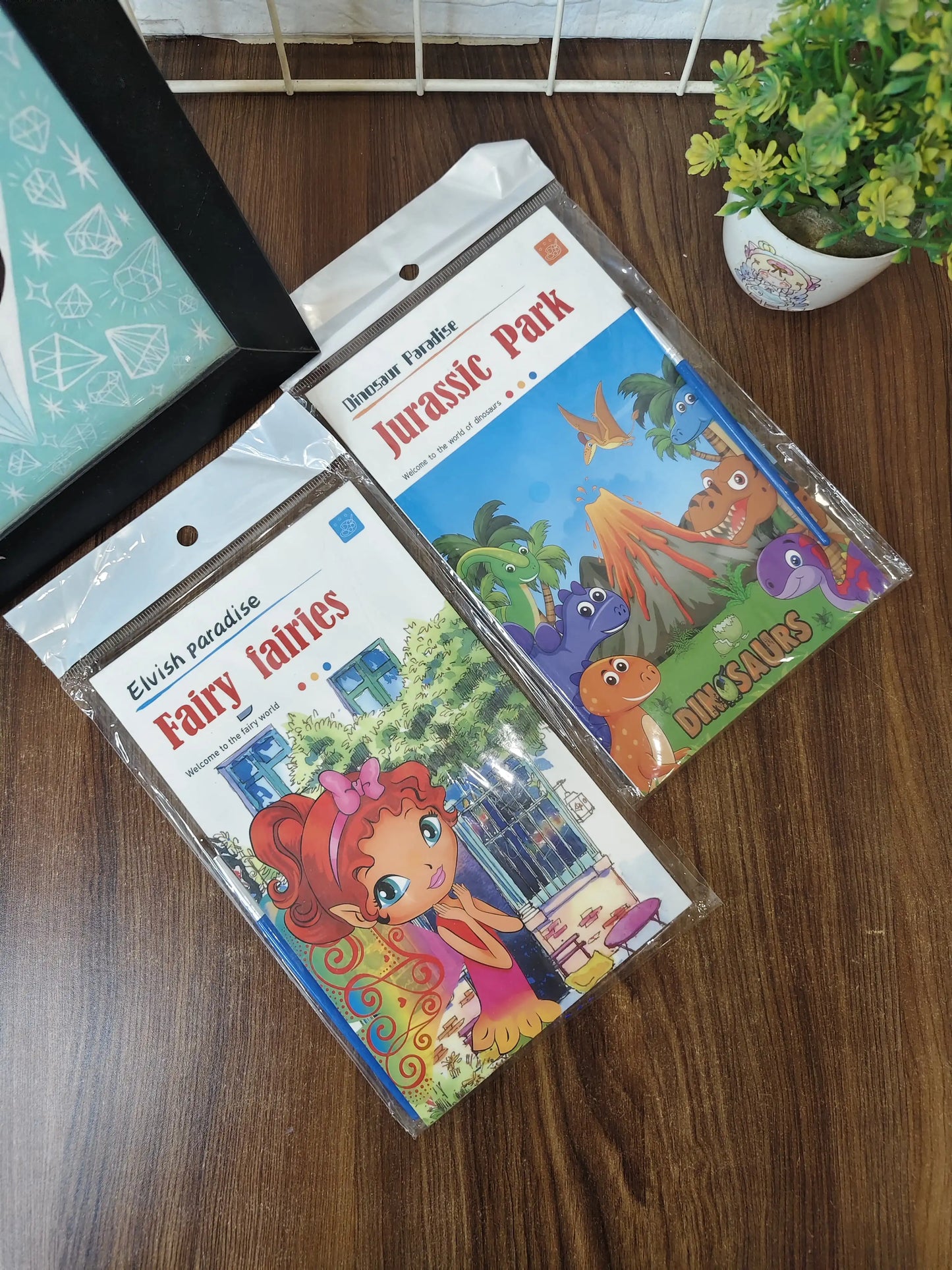 Kids painting books, with watercolors and brush