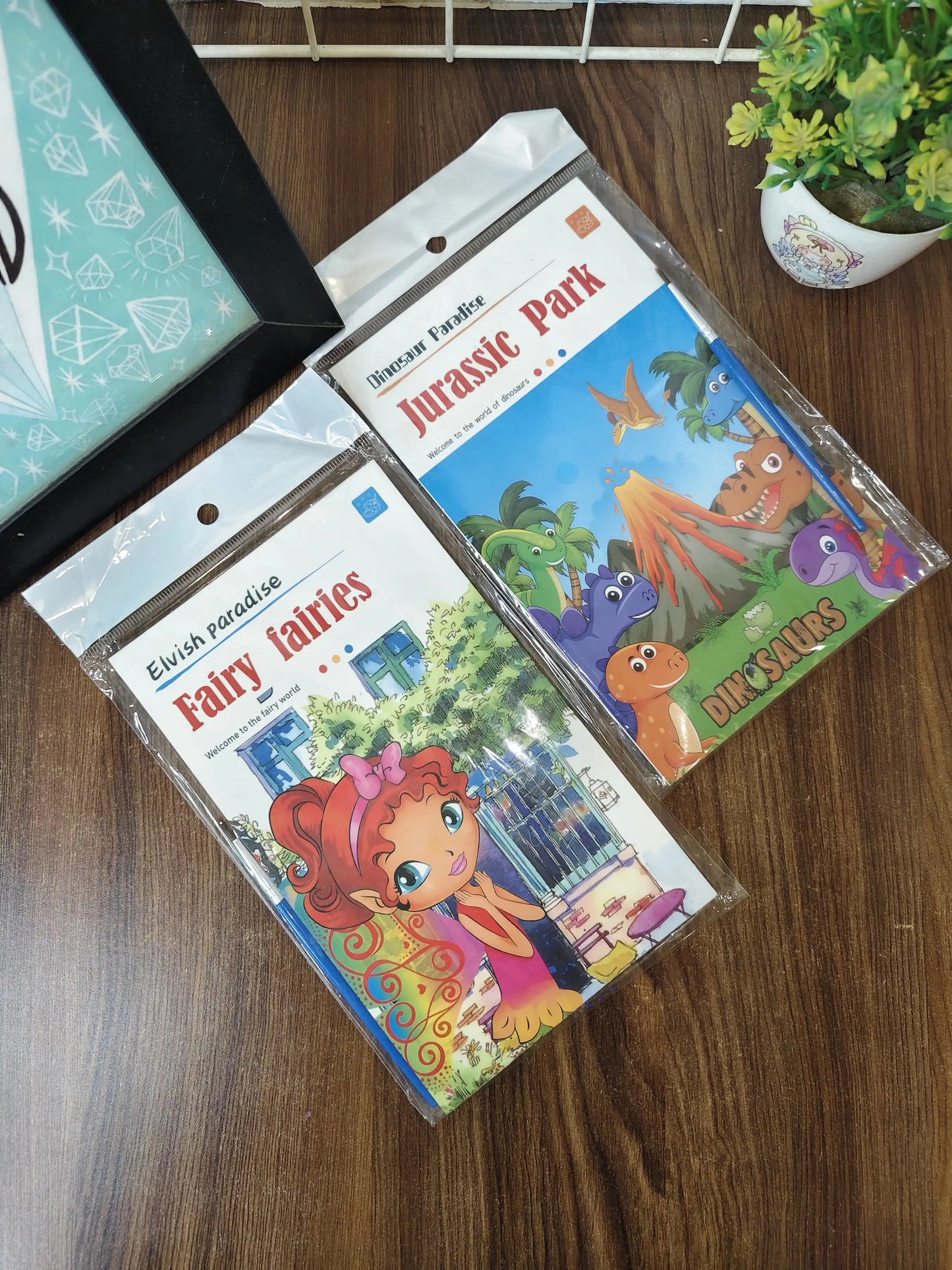 Kids painting books, with watercolors and brush
