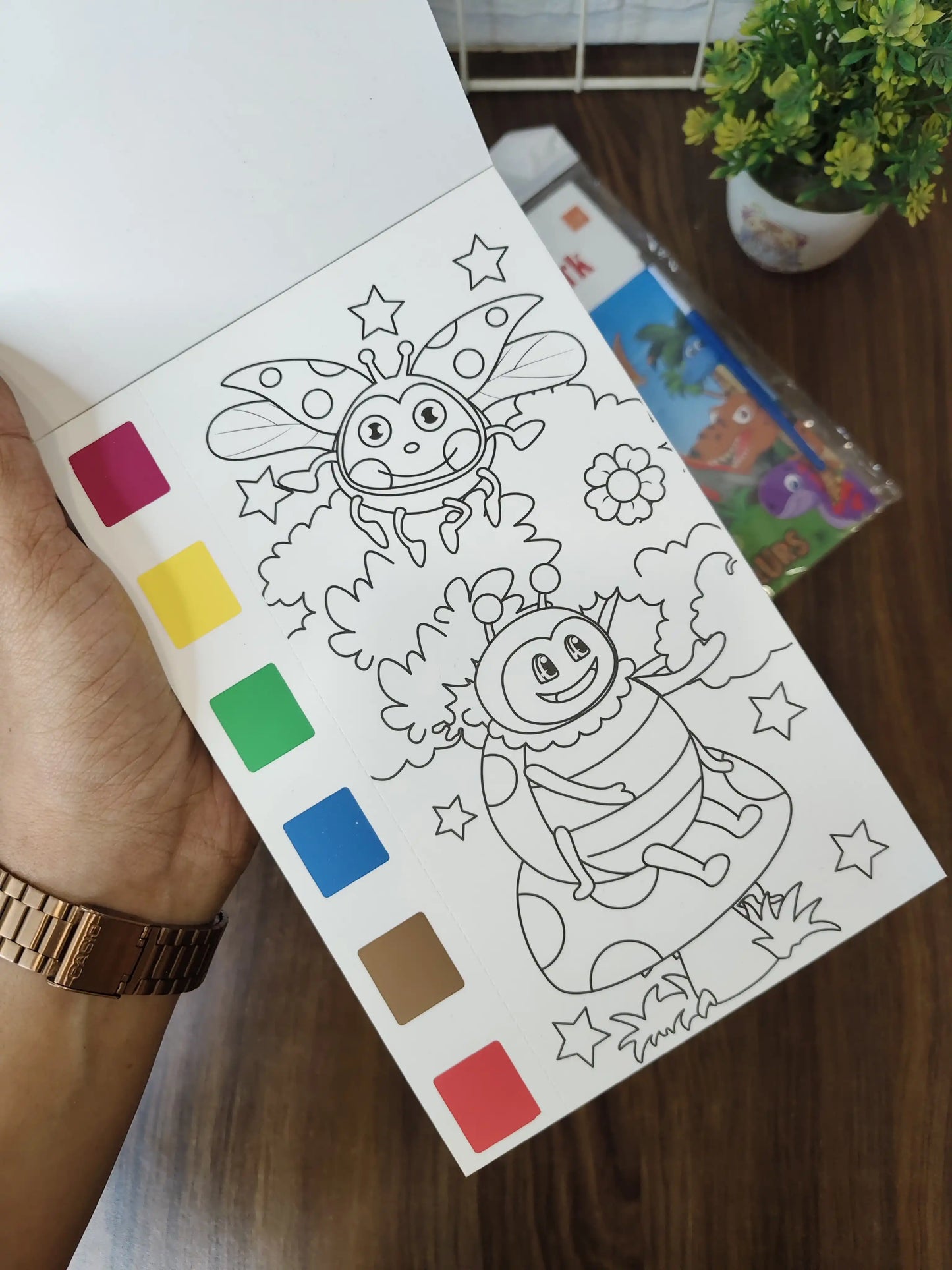 Kids painting books, with watercolors and brush