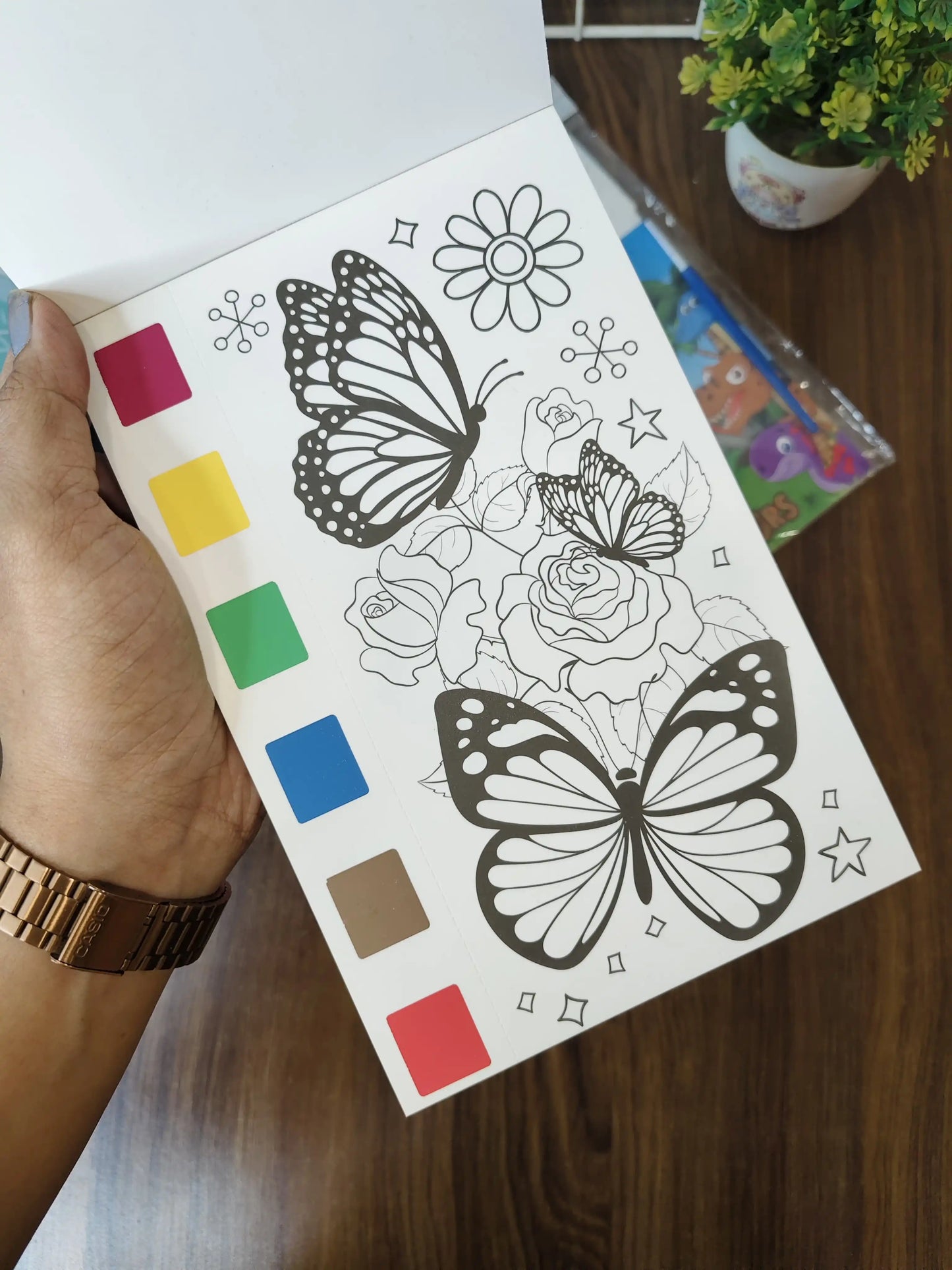 Kids painting books, with watercolors and brush