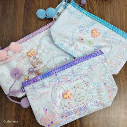 "Glitter Transparent Zipper Pouch – Cute Cartoon Print with Pom Pom Charm"
