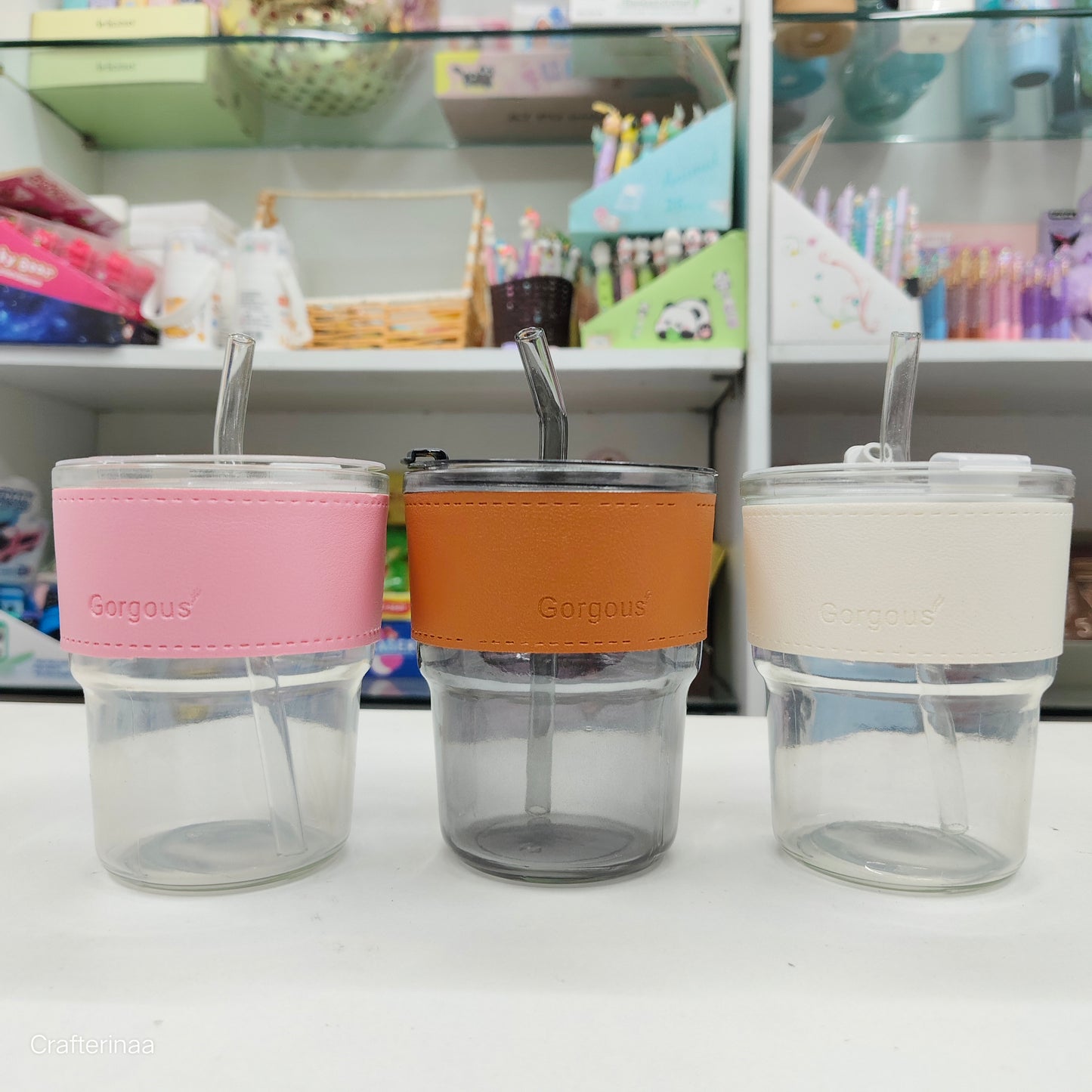 "Elegant Glass Travel Tumbler – Brown Leather Wrap & Transparent Straw"